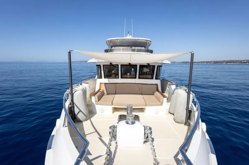 Sedna Yacht Photos Pics Selene 72 Ocean Explorer 2020 yacht on calm blue sea, featuring spacious deck and seating area.