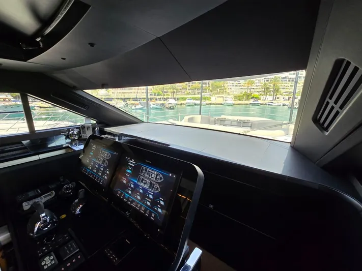 Orca Yacht Photos Pics Cockpit view of 2023 Cranchi Sessantasette 67 yacht with modern navigation displays.