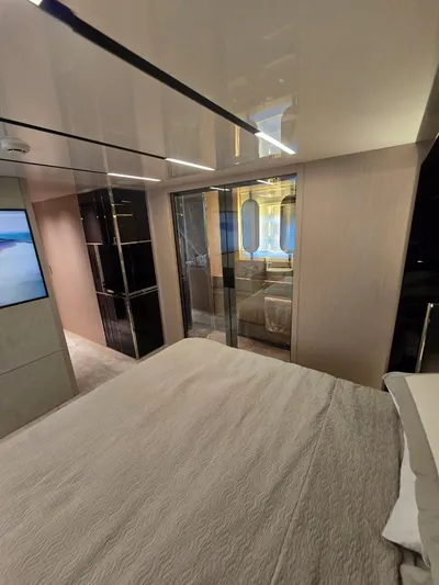 Orca Yacht Photos Pics Luxurious interior of 2023 Cranchi Sessantasette 67 yacht bedroom with modern design and elegant furnishings.