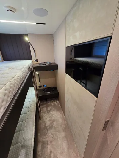Orca Yacht Photos Pics Interior of 2023 Cranchi Sessantasette 67 yacht with modern bunk beds and sleek design.