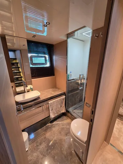 Orca Yacht Photos Pics Luxurious bathroom in 2023 Cranchi Sessantasette 67 yacht with modern fixtures and elegant design.