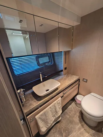 Orca Yacht Photos Pics Luxurious bathroom in 2023 Cranchi Sessantasette 67 yacht with modern fixtures and elegant design.