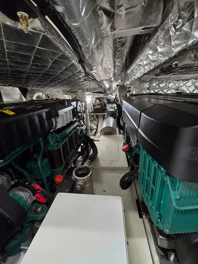 Orca Yacht Photos Pics Engine room of 2023 Cranchi Sessantasette 67 yacht, featuring dual engines and insulated walls.