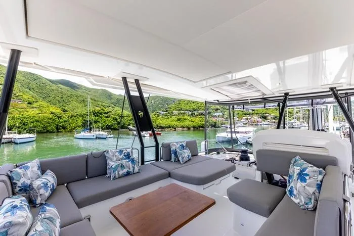 Port To Vino 2 Yacht Photos Pics Luxurious 2023 Fountaine Pajot Samana 59 yacht interior with scenic marina view.