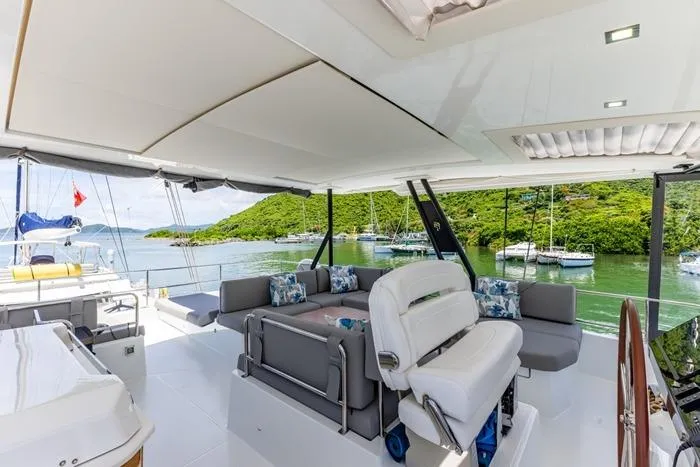 Port To Vino 2 Yacht Photos Pics Luxurious 2023 Fountaine Pajot Samana 59 yacht interior with scenic marina view.