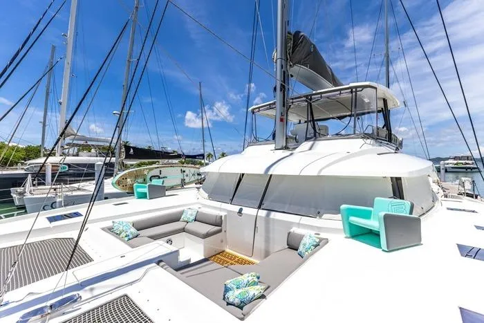 Port To Vino 2 Yacht Photos Pics Luxurious 2023 Fountaine Pajot Samana 59 catamaran with spacious deck and modern seating.