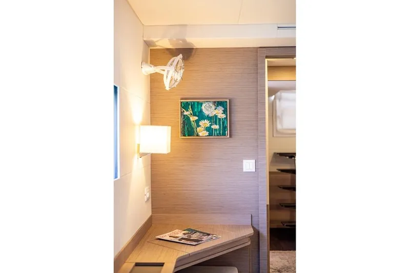 Port To Vino 2 Yacht Photos Pics Interior of 2023 Fountaine Pajot Samana 59 yacht with modern decor and wall art.