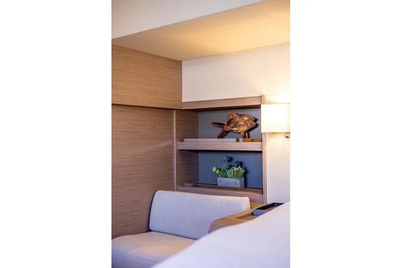 Port To Vino 2 Yacht Photos Pics Modern interior of 2023 Fountaine Pajot Samana 59 yacht with elegant decor and seating.