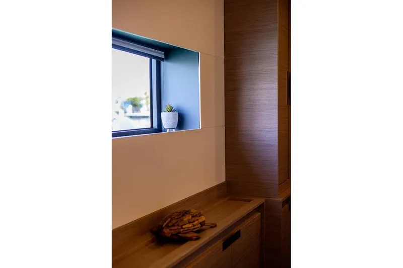 Port To Vino 2 Yacht Photos Pics Interior of 2023 Fountaine Pajot Samana 59 yacht with window and decor.