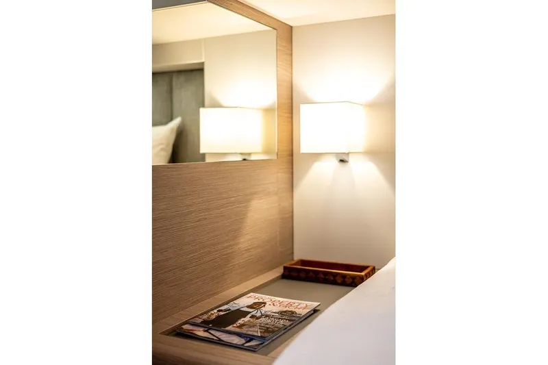 Port To Vino 2 Yacht Photos Pics Luxurious interior of 2023 Fountaine Pajot Samana 59 yacht with elegant lighting and decor.