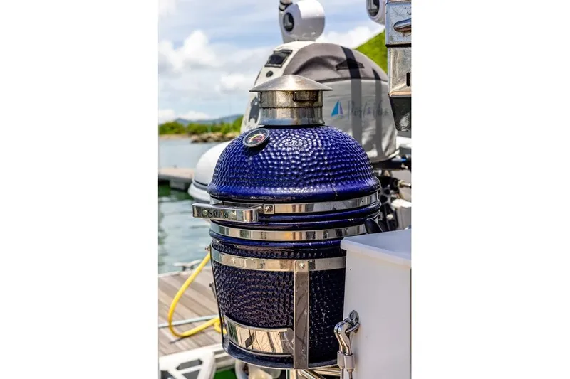 Port To Vino 2 Yacht Photos Pics Blue ceramic grill on 2023 Fountaine Pajot Samana 59 yacht deck.