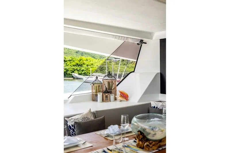 Port To Vino 2 Yacht Photos Pics Luxurious interior of 2023 Fountaine Pajot Samana 59 yacht with elegant decor.