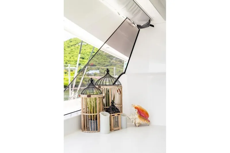 Port To Vino 2 Yacht Photos Pics Decorative birdcages and seashell on Fountaine Pajot Samana 59 yacht, 2023 model.