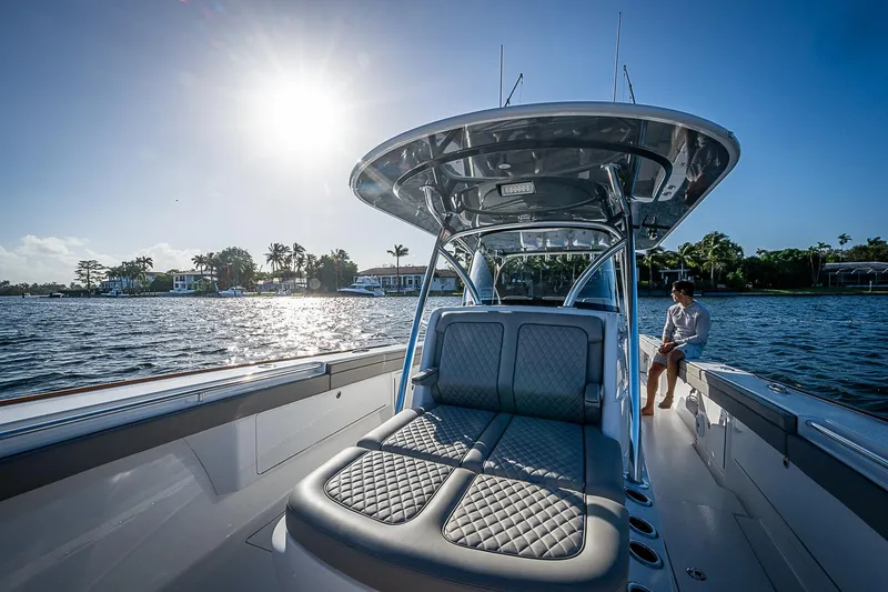 Farniente Yacht Photos Pics 2022 Valhalla V41 boat on water, sunny day, luxurious seating, scenic view.