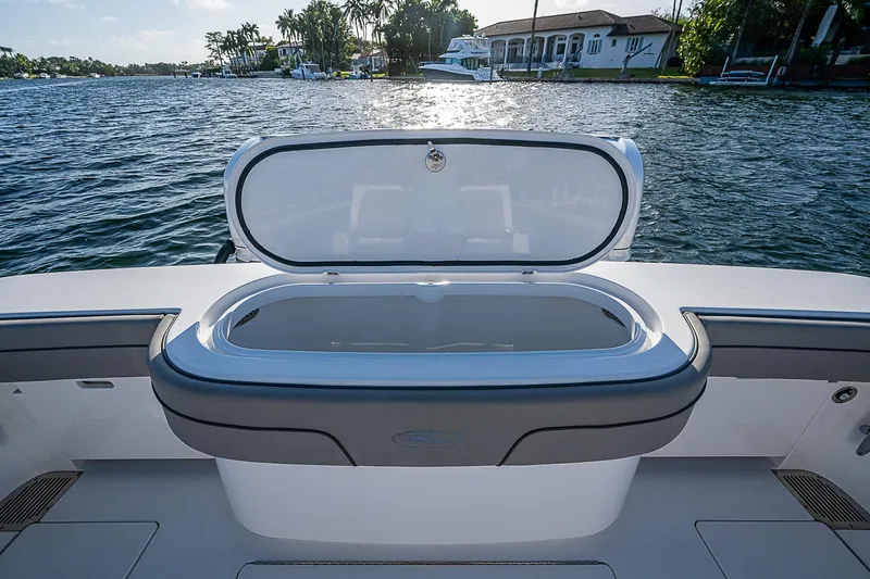 Farniente Yacht Photos Pics 2022 Valhalla Boatworks V41 livewell on deck, overlooking serene waterfront.