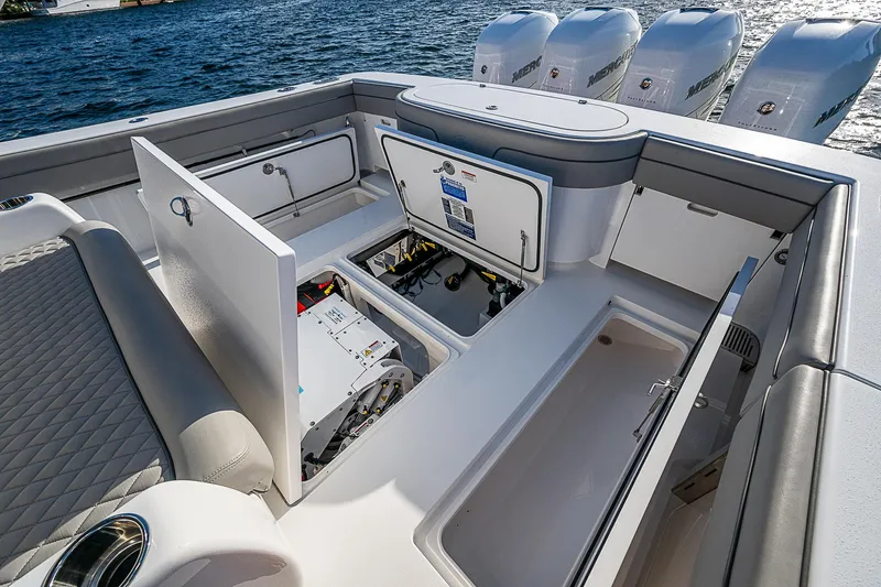 Farniente Yacht Photos Pics 2022 Valhalla V41 boat interior with open storage compartments and visible engines.