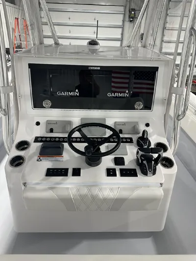  Yacht Photos Pics 2024 Contender 39 ST boat dashboard with Garmin navigation system.