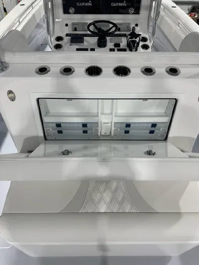 Yacht Photos Pics 2024 Contender 39 ST boat interior with Garmin electronics and storage compartments.