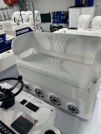  Yacht Photos Pics 2024 Contender 39 ST boat interior with white seating and multiple speakers.