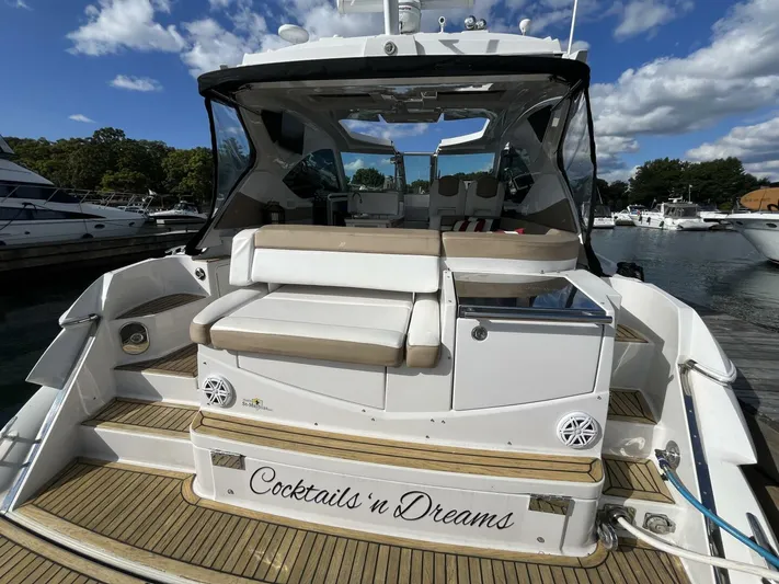  Yacht Photos Pics 2014 Four Winns V435 yacht with "Cocktails 'n Dreams" name, docked at a marina.