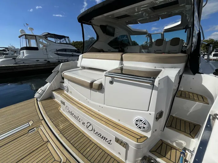  Yacht Photos Pics 2014 Four Winns V435 yacht with seating and storage, docked at a marina.