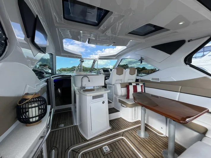  Yacht Photos Pics Interior of 2014 Four Winns V435 yacht with modern seating and sleek design.