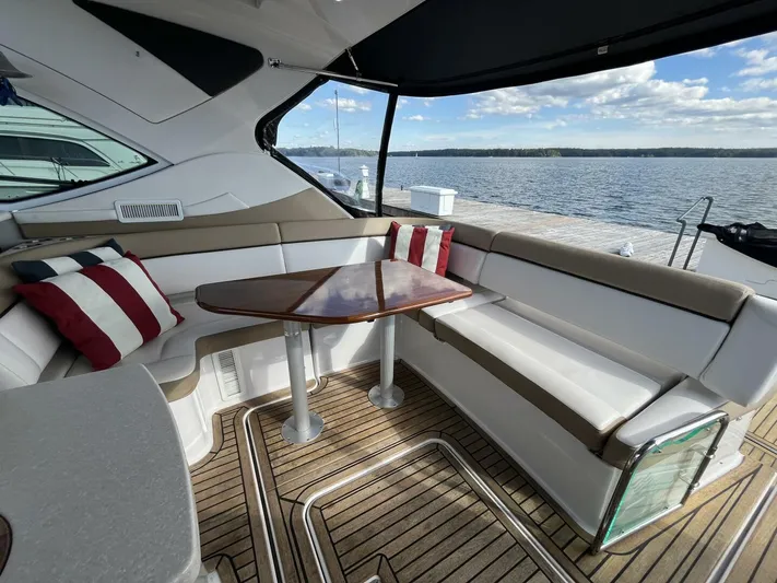  Yacht Photos Pics Luxurious 2014 Four Winns V435 yacht interior with elegant seating and scenic water view.