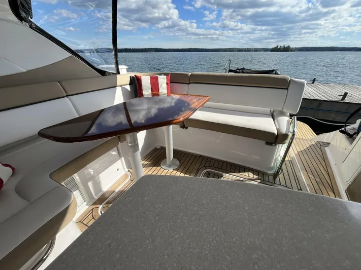  Yacht Photos Pics 2014 Four Winns V435 yacht interior with seating, table, and scenic water view.