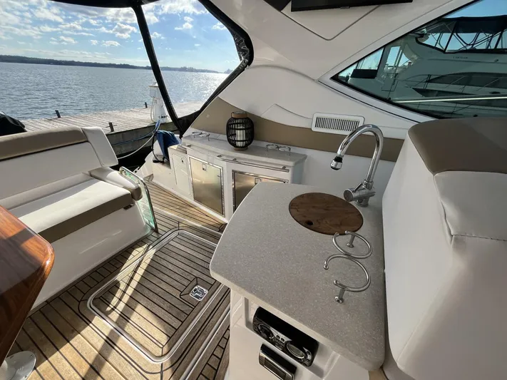  Yacht Photos Pics Luxurious 2014 Four Winns V435 yacht interior with sleek design and waterfront view.