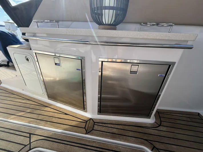  Yacht Photos Pics 2014 Four Winns V435 yacht with stainless steel cabinets and wooden deck.