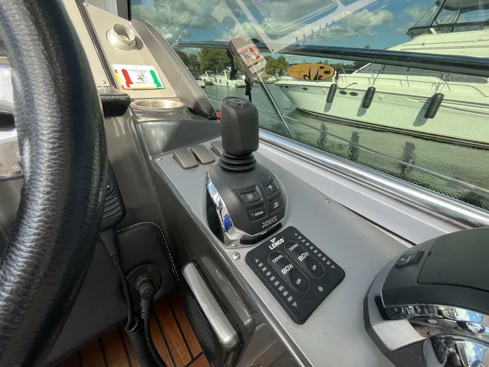  Yacht Photos Pics Control panel of 2014 Four Winns V435 boat with joystick and navigation controls.