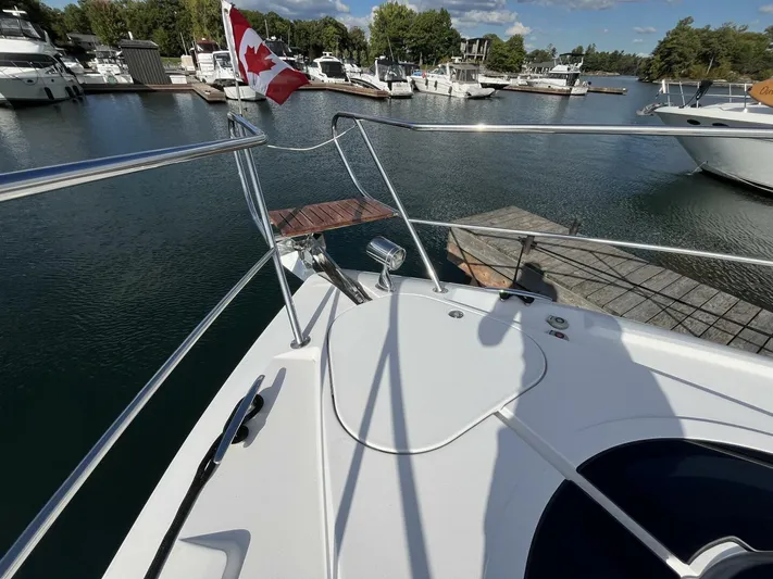  Yacht Photos Pics 2014 Four Winns V435 yacht docked at marina with Canadian flag.