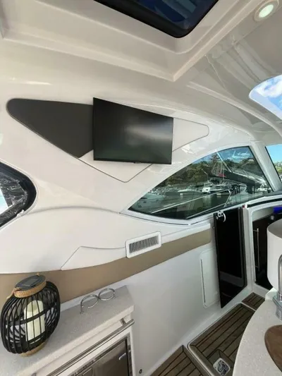 Yacht Photos Pics Interior of 2014 Four Winns V435 yacht with modern design and mounted TV.