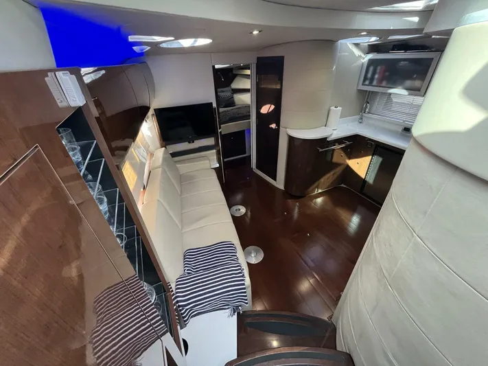  Yacht Photos Pics Luxurious interior of 2014 Four Winns V435 yacht with modern kitchen and seating area.