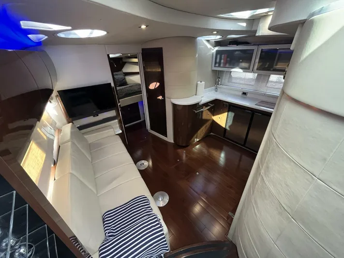  Yacht Photos Pics Luxurious interior of 2014 Four Winns V435 yacht with modern kitchen and seating area.