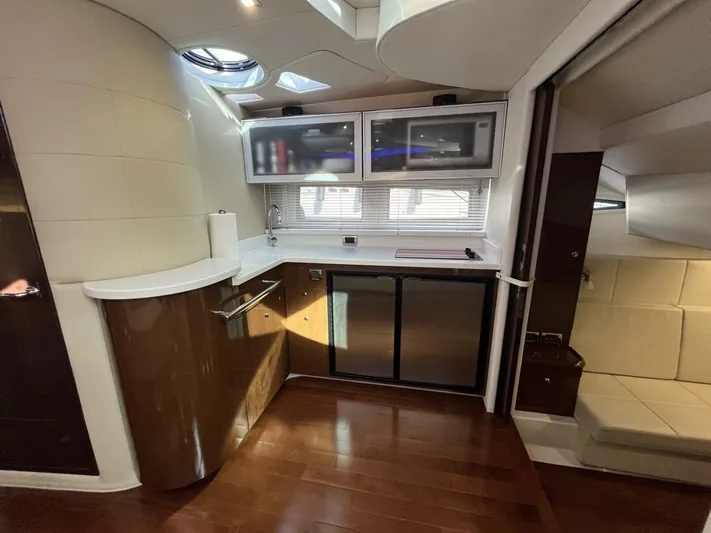 Yacht Photos Pics Luxurious 2014 Four Winns V435 yacht interior with modern kitchen and sleek cabinetry.