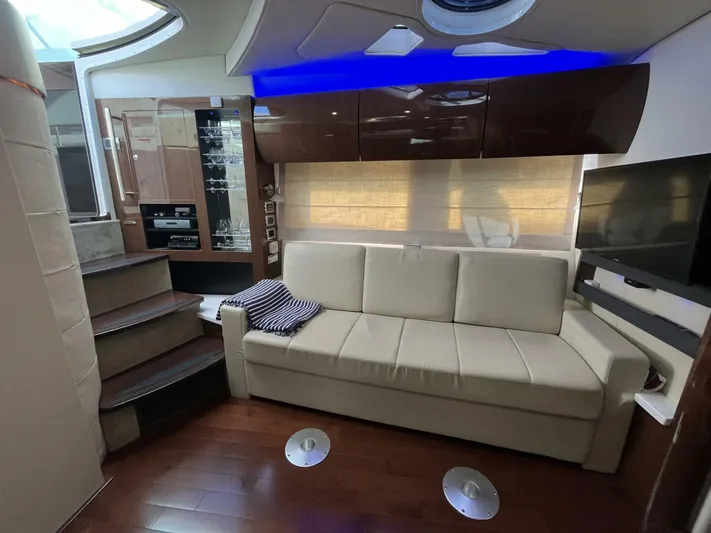  Yacht Photos Pics Luxurious interior of 2014 Four Winns V435 yacht with beige sofa and modern amenities.