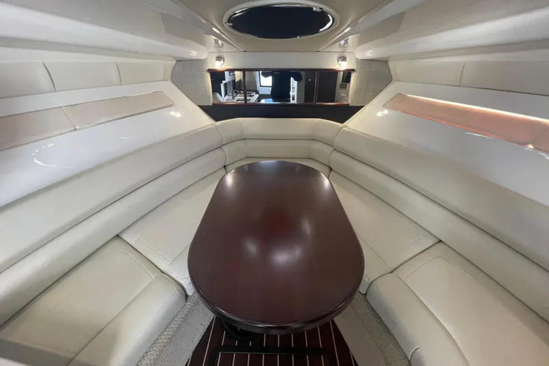  Yacht Photos Pics Luxurious interior of 2019 Monterey 295 Sport Yacht with elegant seating and wooden table.