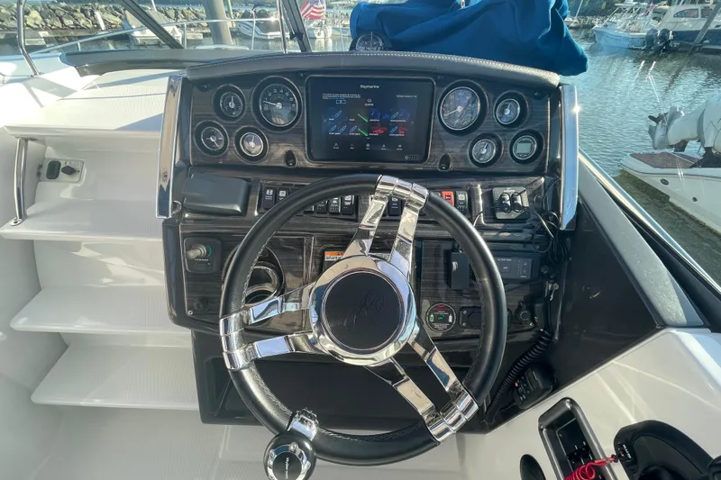  Yacht Photos Pics 2019 Monterey 295 Sport Yacht helm with modern controls and navigation system.