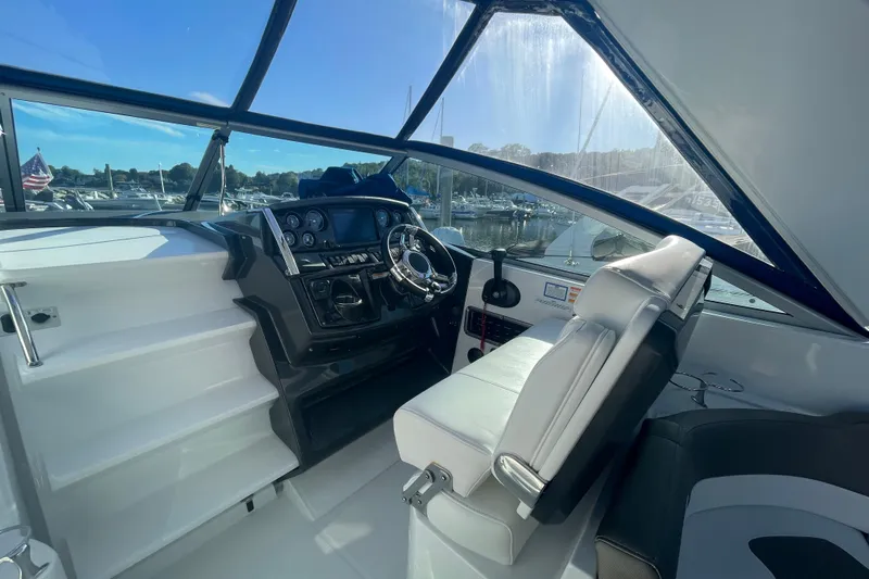  Yacht Photos Pics 2019 Monterey 295 Sport Yacht helm with modern controls and panoramic marina view.