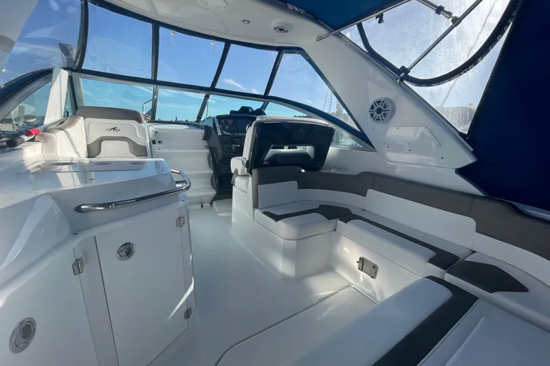  Yacht Photos Pics Interior of a 2019 Monterey 295 Sport Yacht, featuring sleek seating and modern design.