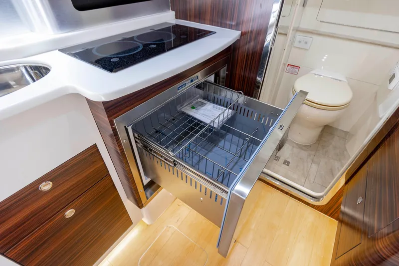  Yacht Photos Pics Luxurious 2019 Scout 420 LXF yacht interior with modern kitchen and bathroom amenities.