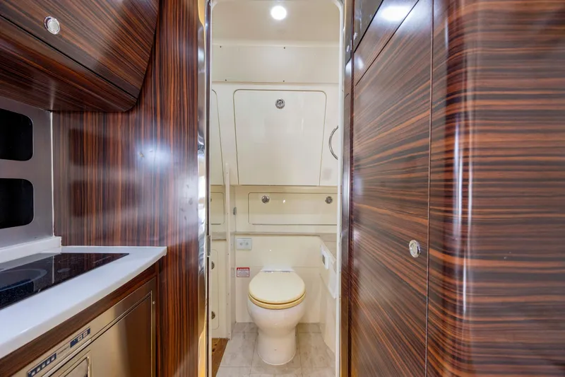  Yacht Photos Pics Luxurious 2019 Scout 420 LXF yacht interior with wood finish and modern amenities.