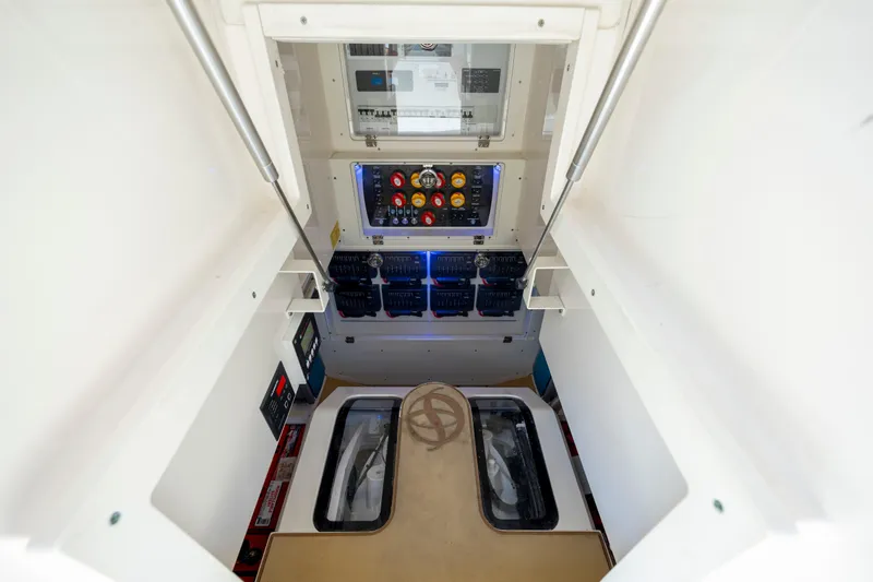  Yacht Photos Pics 2019 Scout 420 LXF engine room with control panel and equipment.