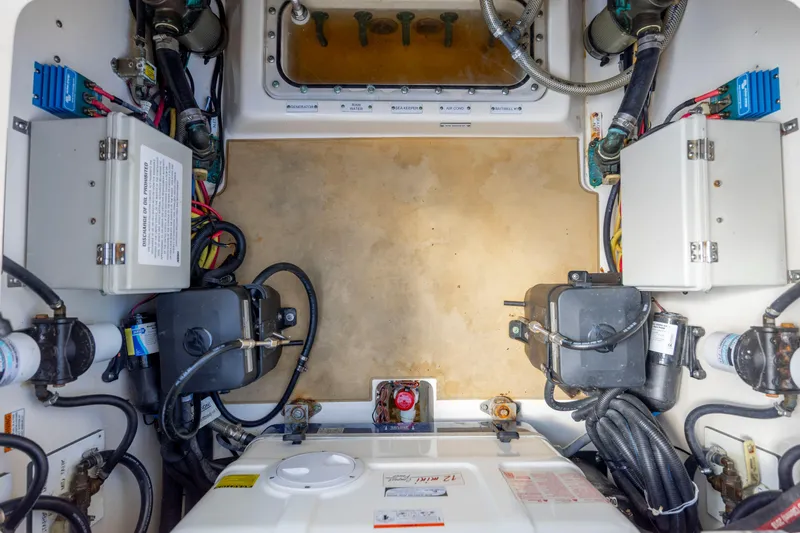  Yacht Photos Pics Engine compartment of 2019 Scout 420 LXF boat, showcasing wiring and mechanical components.