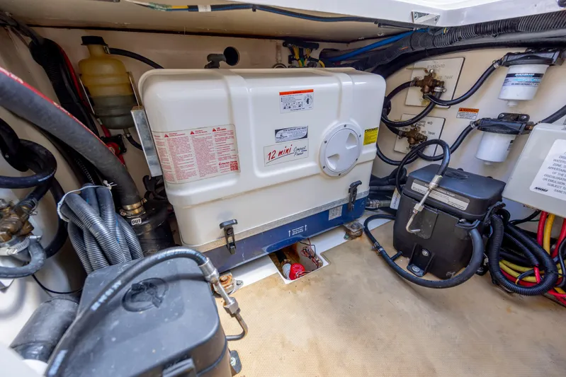  Yacht Photos Pics Engine room of 2019 Scout 420 LXF boat with various mechanical components.