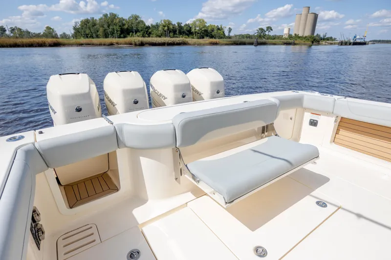  Yacht Photos Pics 2019 Scout 420 LXF boat with quad Mercury engines, spacious deck, and comfortable seating.