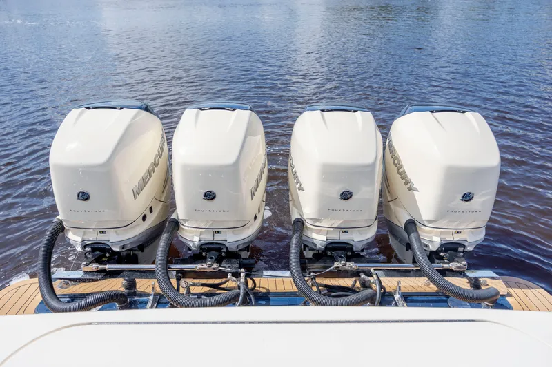  Yacht Photos Pics Four Mercury outboard engines on a 2019 Scout 420 LXF boat in water.