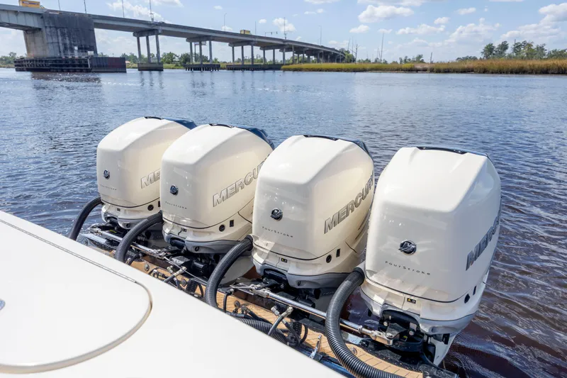  Yacht Photos Pics Four Mercury outboard engines on a 2019 Scout 420 LXF boat near a bridge.