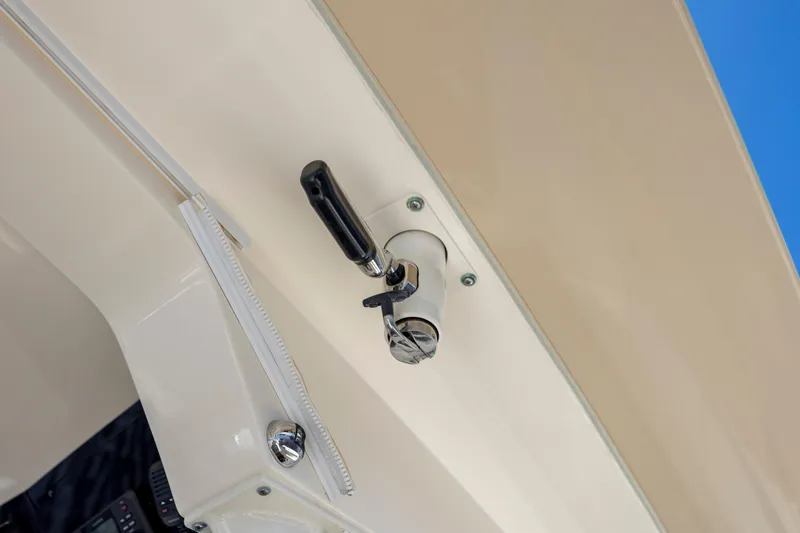  Yacht Photos Pics Close-up of a 2019 Scout 420 LXF boat's latch mechanism against a blue sky.